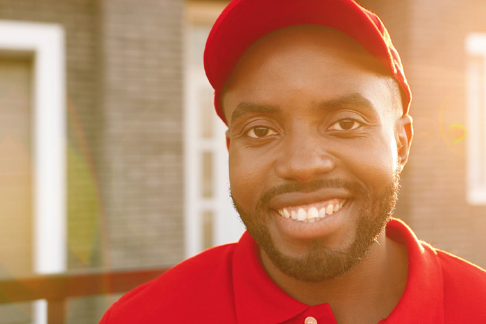 man in red cap and red shirt smiling
